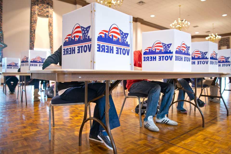 Students vote in the St. Louis Room