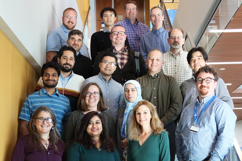 Computer Science Faculty posed on stairs of the ISE Building.